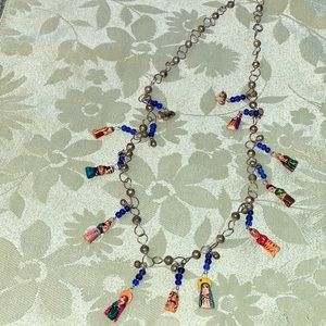 Nativity scene necklace and is 25 inches in length.